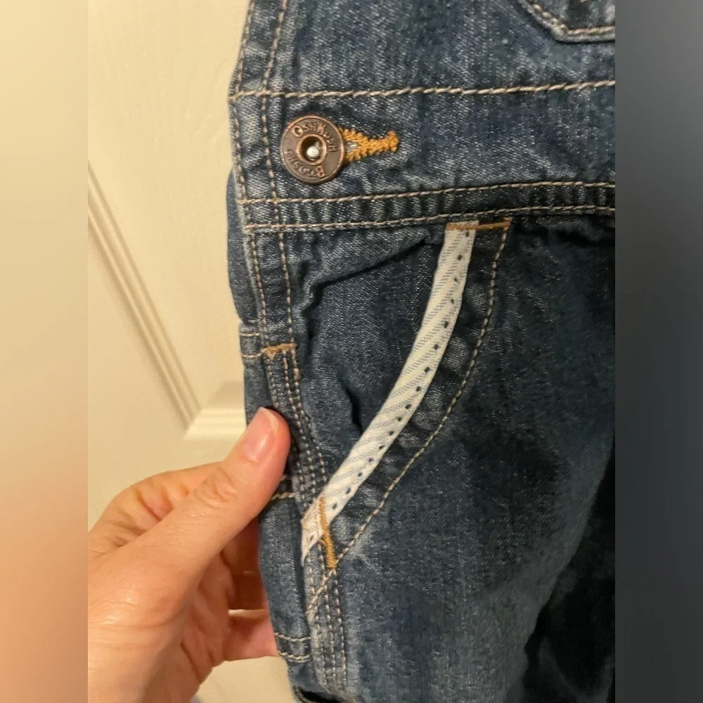 Osh Kosh Denim overalls with patches and spell out